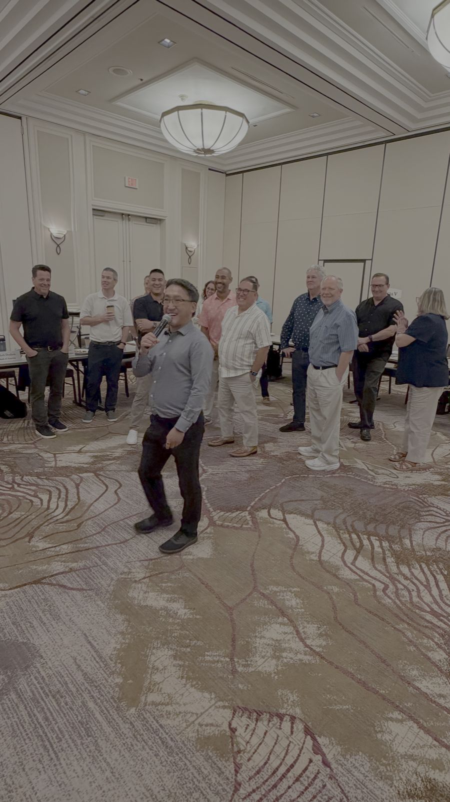 Stuart Takehara leads a lively icebreaker with board members during an annual strategic planning retreat