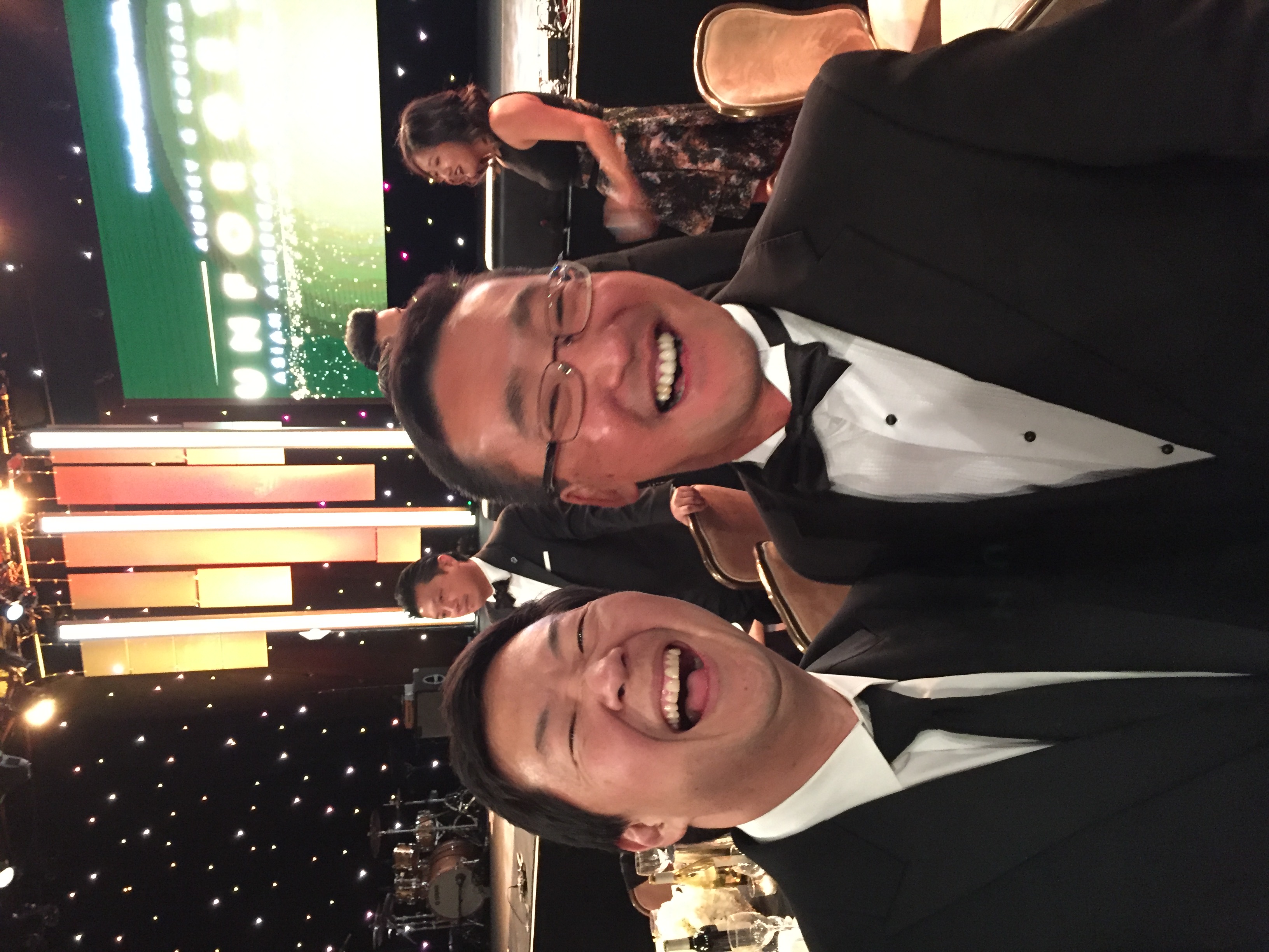 Stuart Takehara attending a formal community event