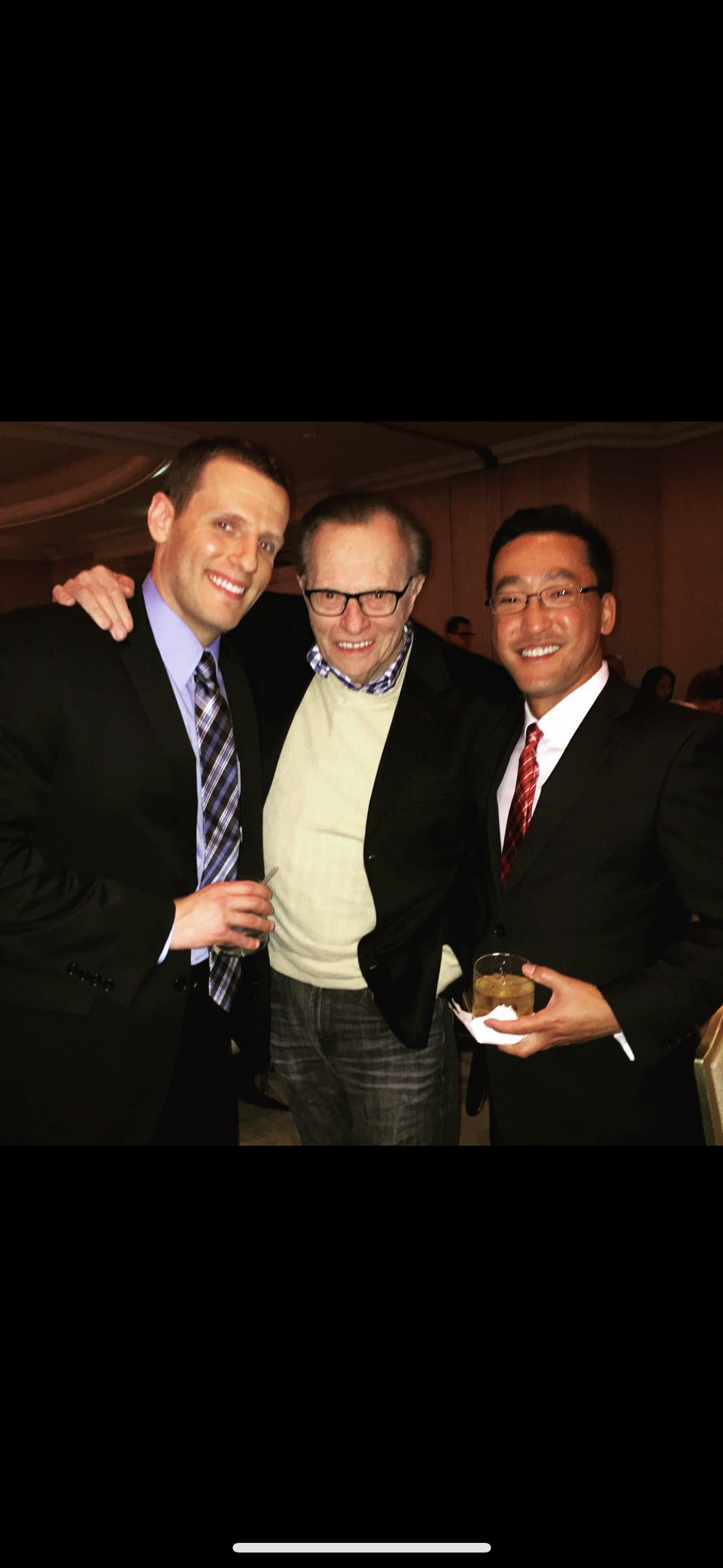 Stuart Takehara with media and business leaders at an event